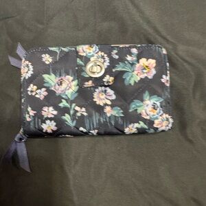 This is a Vera Bradley RFID Turnlock Wallet in Navy Floral Pattern